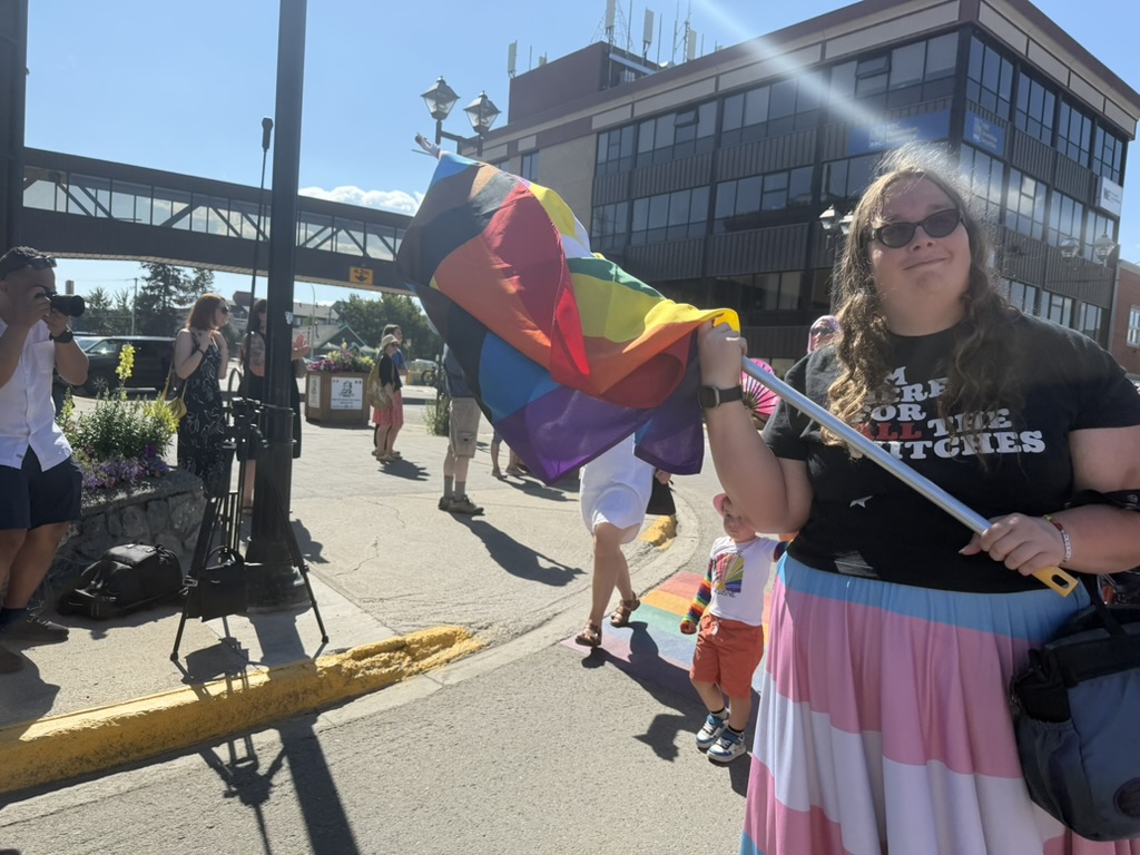 A picture of me at the corner of 3rd & Main in Whitehorse, marching in the 2026 Whitehorse Pride Parade